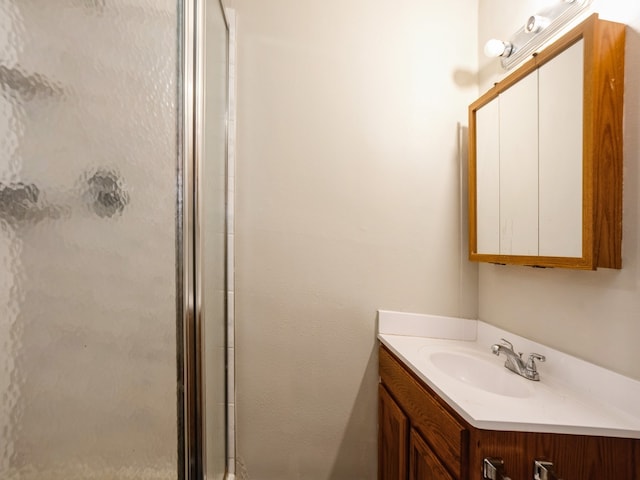 bathroom featuring vanity and walk in shower