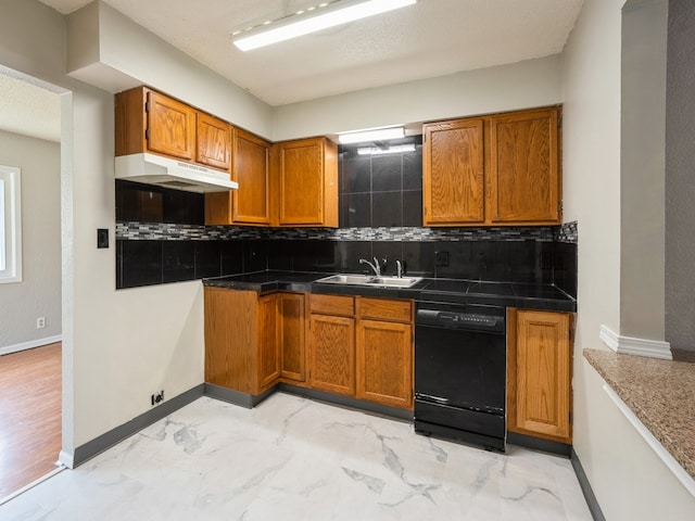 kitchen featuring black dishwasher, a textured ceiling, decorative backsplash, and sink