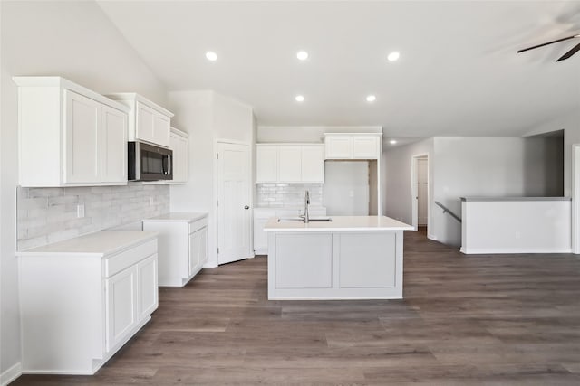 732 NE Deerfield Dr, Ankeny, IA 50021 - kitchen featuring a sink, a kitchen island with sink, tasteful backsplash, white cabinets, and recessed lighting