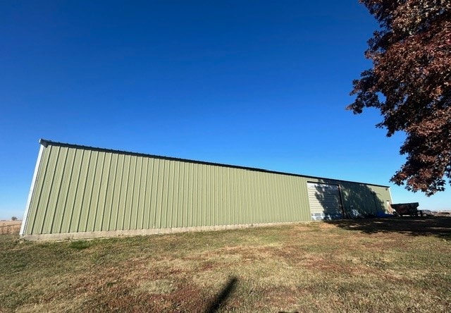 view of property exterior featuring a yard