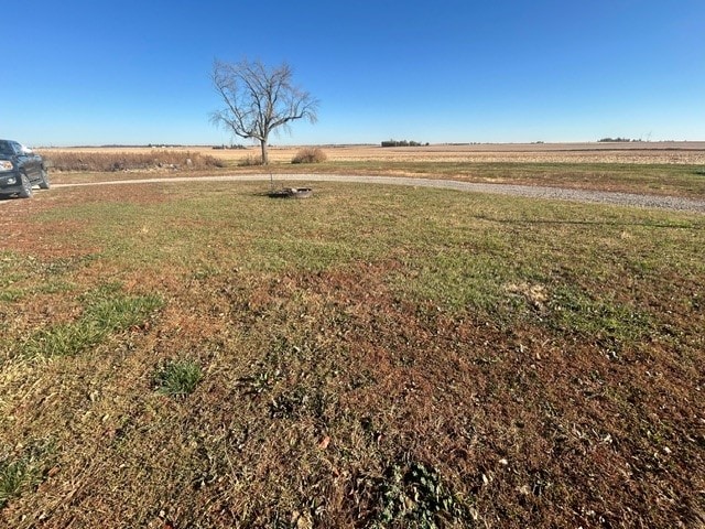 view of yard with a rural view