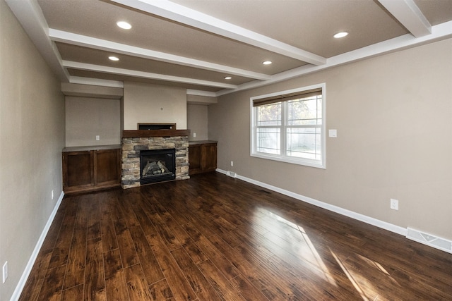 unfurnished living room with beam ceiling, a fireplace, and dark hardwood / wood-style flooring