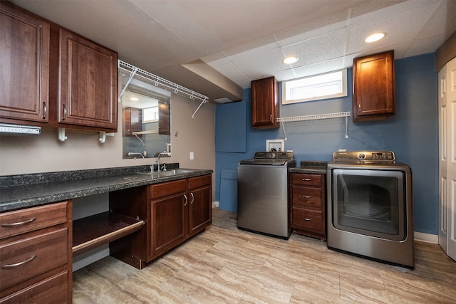 kitchen featuring light hardwood / wood-style floors, sink, and separate washer and dryer