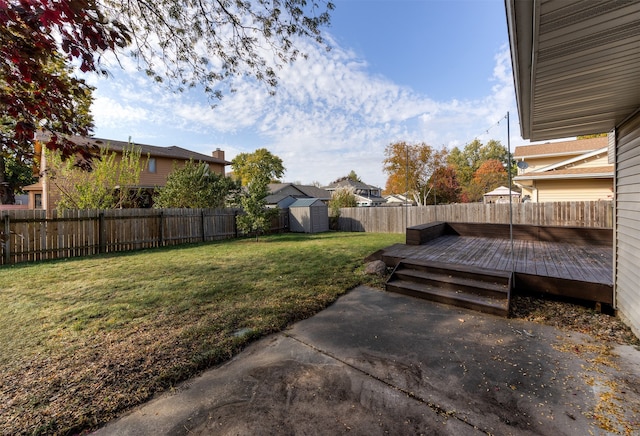 view of yard with a shed and a deck