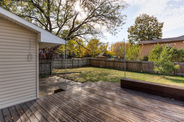 wooden deck with a lawn