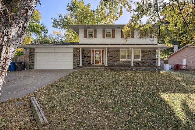 front facade with a porch, a front lawn, and a garage