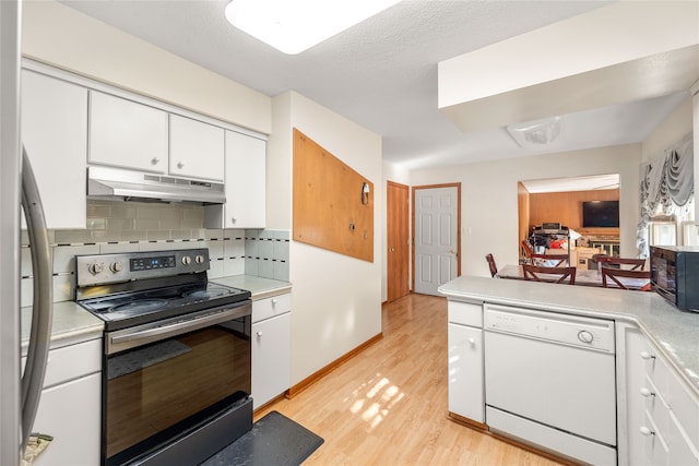 kitchen featuring electric range, backsplash, white cabinetry, dishwasher, and light hardwood / wood-style floors