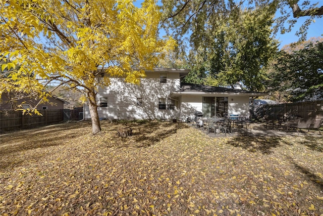 back of property featuring a patio area