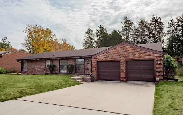 ranch-style home with a front lawn and a garage