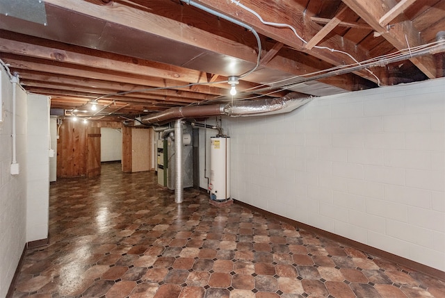 basement featuring water heater and heating unit