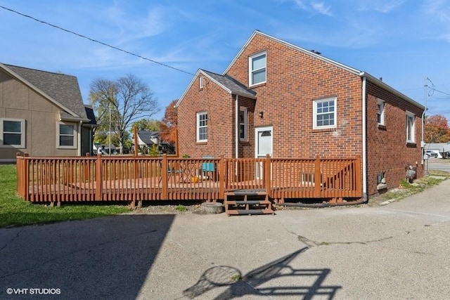 back of house with a wooden deck