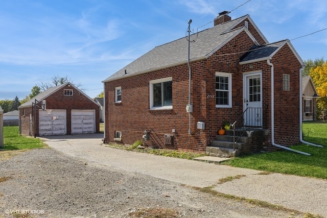 view of front of house with an outbuilding and a garage