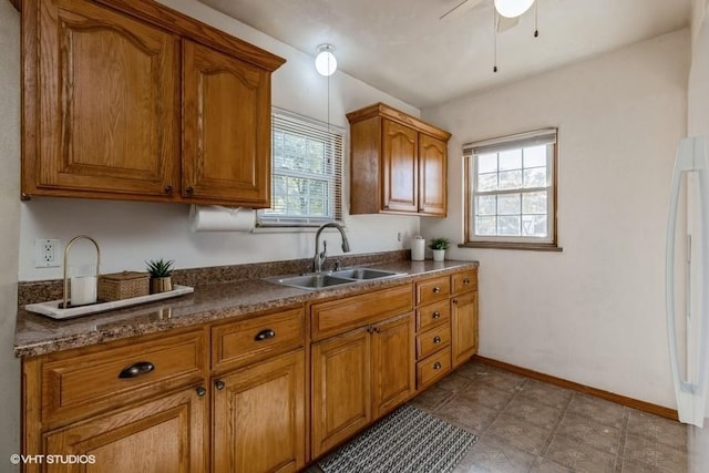 kitchen with ceiling fan and sink