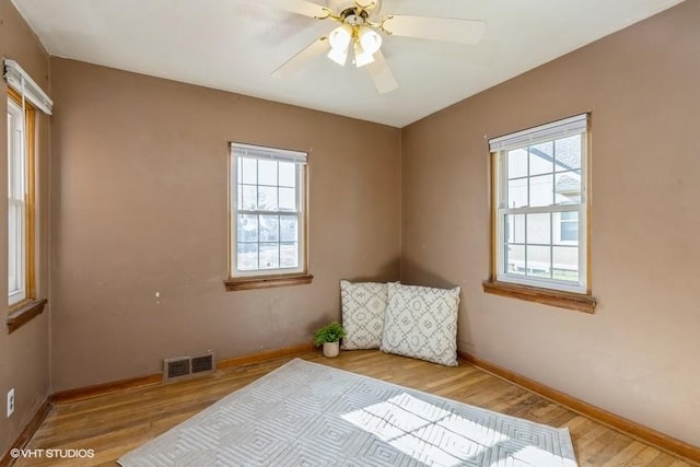 spare room with ceiling fan and light hardwood / wood-style flooring