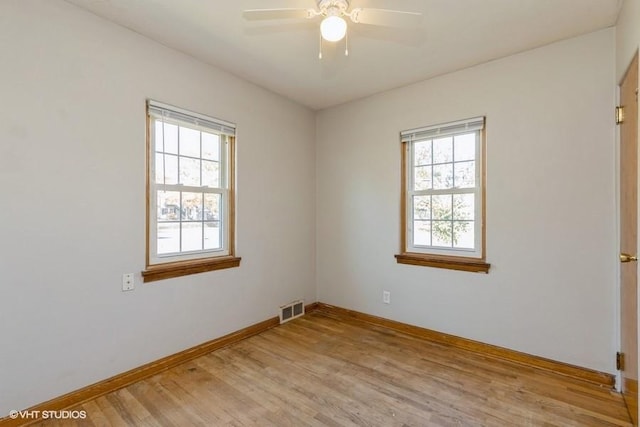 unfurnished room with ceiling fan and light wood-type flooring