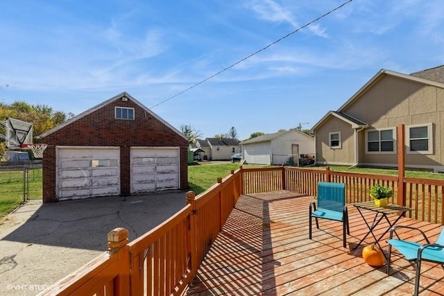 deck with an outbuilding and a garage