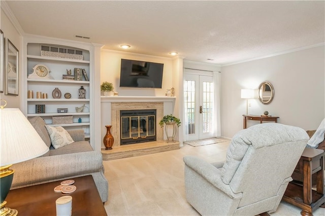 carpeted living room featuring french doors and ornamental molding