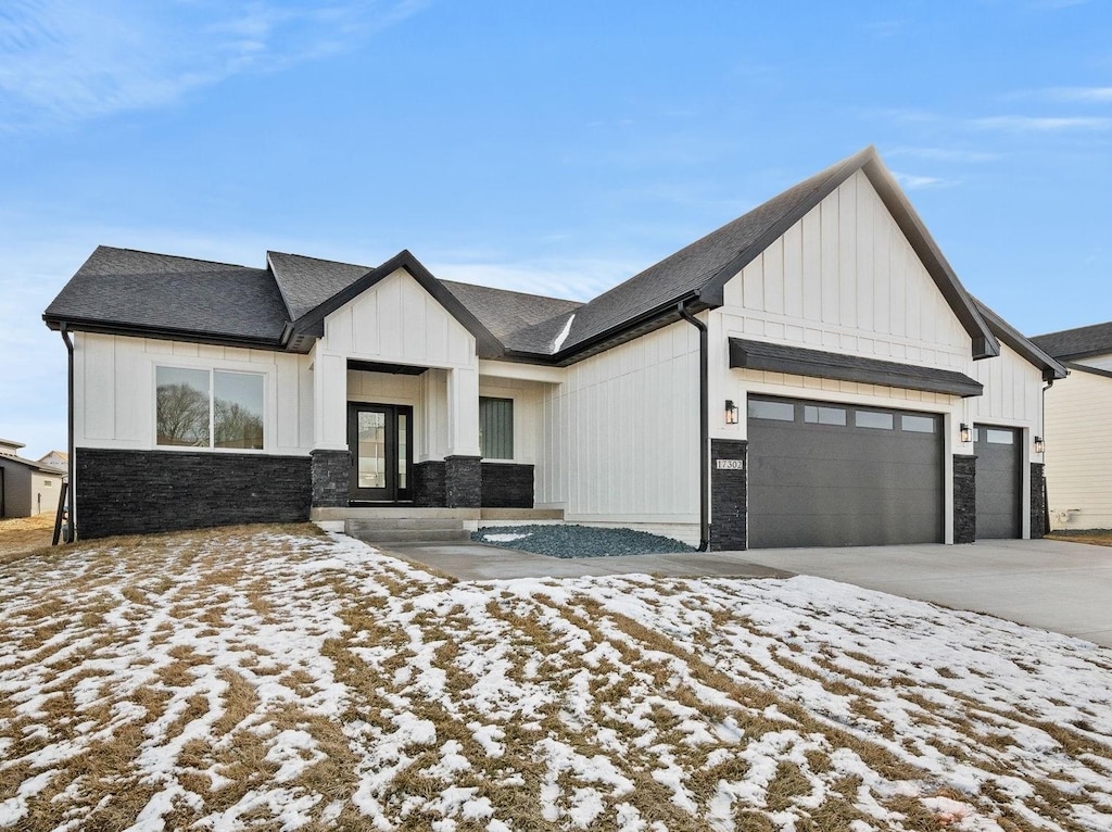 modern farmhouse featuring a garage