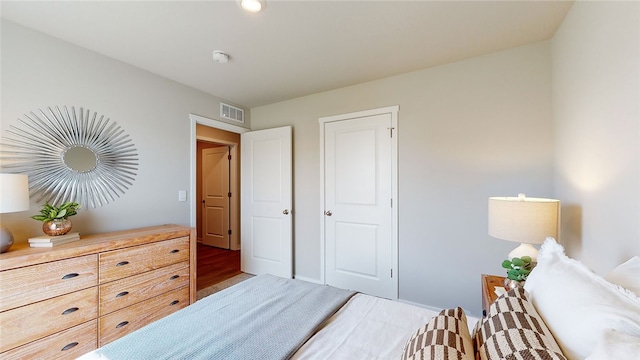 bedroom with wood-type flooring