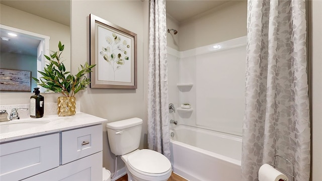 full bathroom featuring vanity, shower / tub combo, and toilet