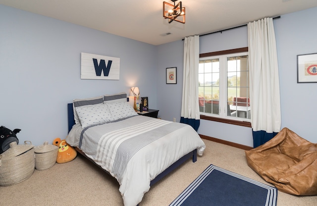 bedroom featuring light colored carpet