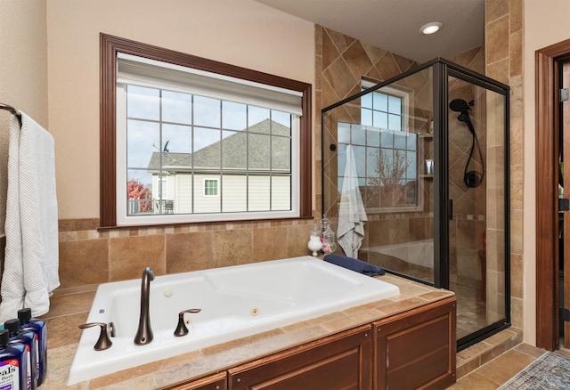 bathroom featuring independent shower and bath