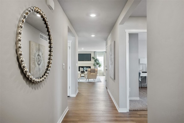 hall with wood-type flooring