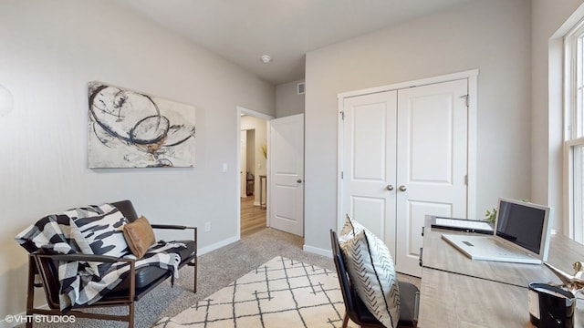 home office featuring light colored carpet