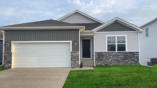 view of front of house with a front yard and a garage