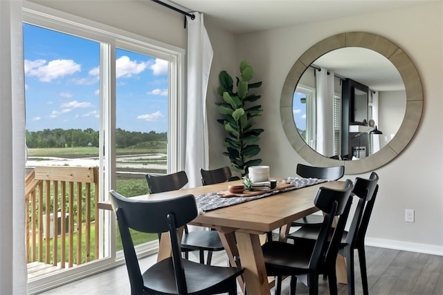 dining space featuring hardwood / wood-style flooring