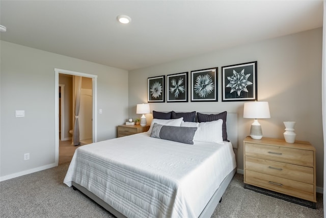 bedroom featuring light carpet