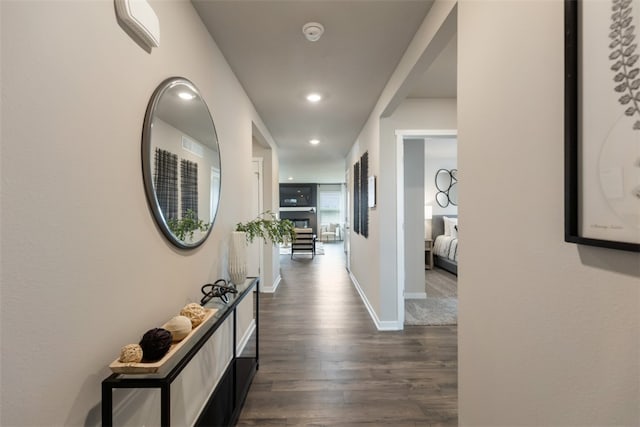 corridor featuring dark hardwood / wood-style floors