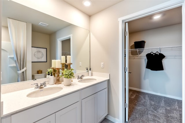 bathroom featuring toilet and vanity