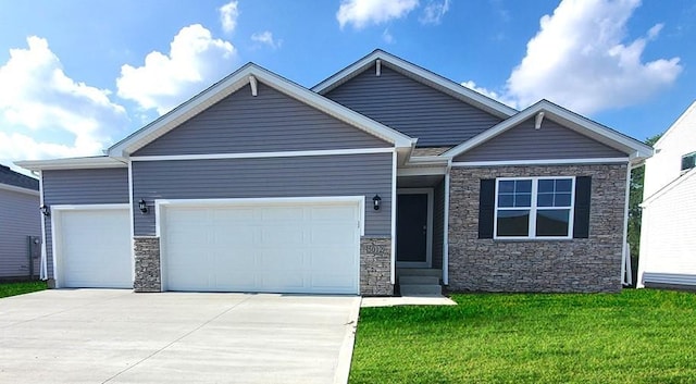 view of front of property featuring a garage, a front yard, stone siding, entry steps, and driveway