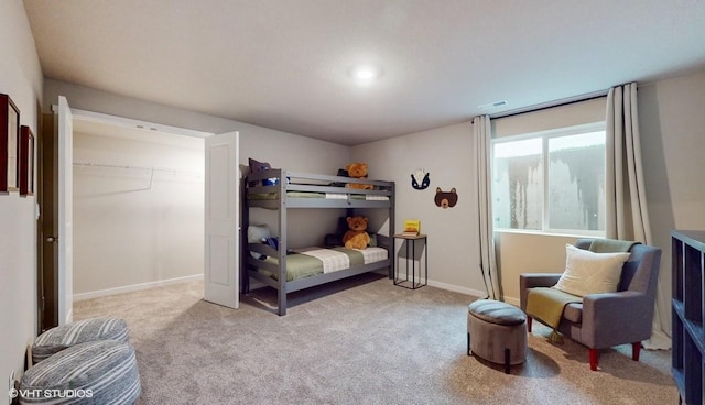carpeted bedroom with baseboards