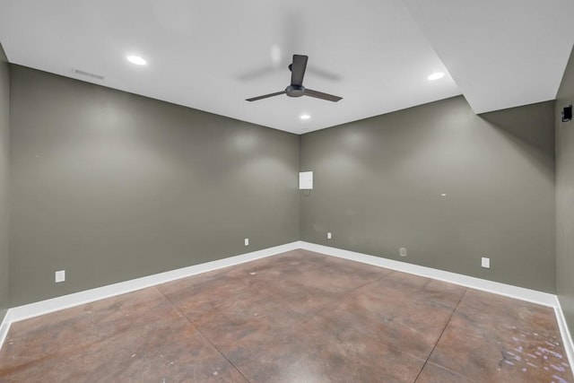 spare room featuring ceiling fan and concrete flooring