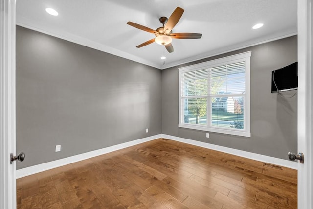 unfurnished room with crown molding, ceiling fan, and hardwood / wood-style floors