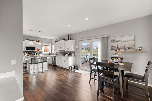 dining area featuring dark hardwood / wood-style flooring