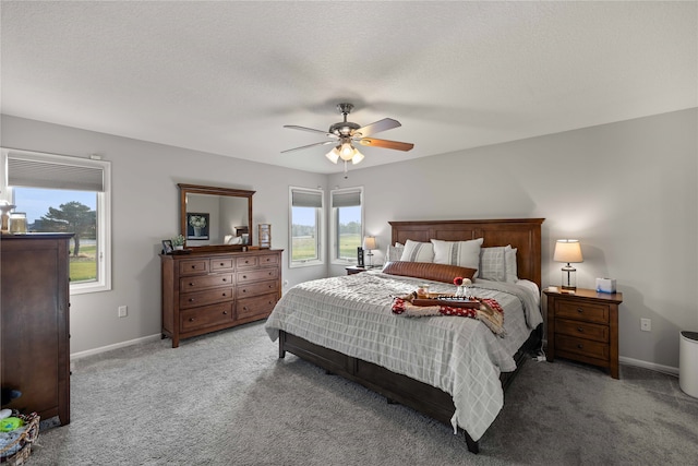 bedroom with light carpet, a textured ceiling, and ceiling fan