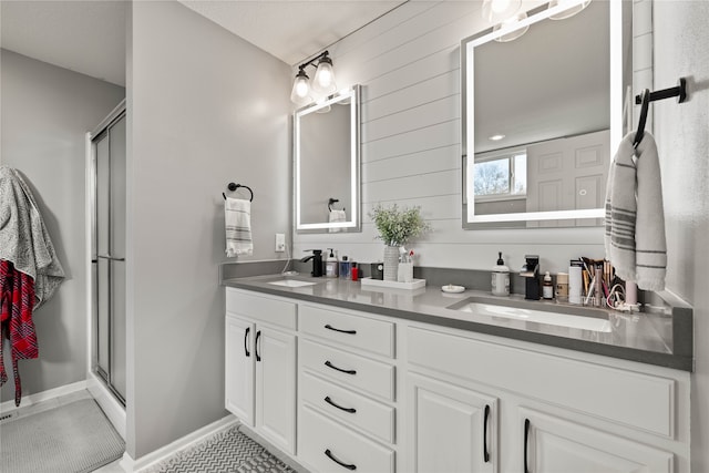 bathroom featuring vanity, tile patterned flooring, and an enclosed shower