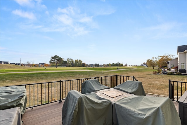 wooden deck featuring a yard