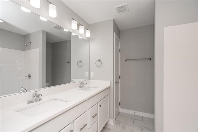 bathroom featuring vanity and walk in shower