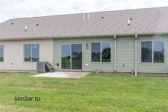 rear view of house featuring a patio area and a lawn