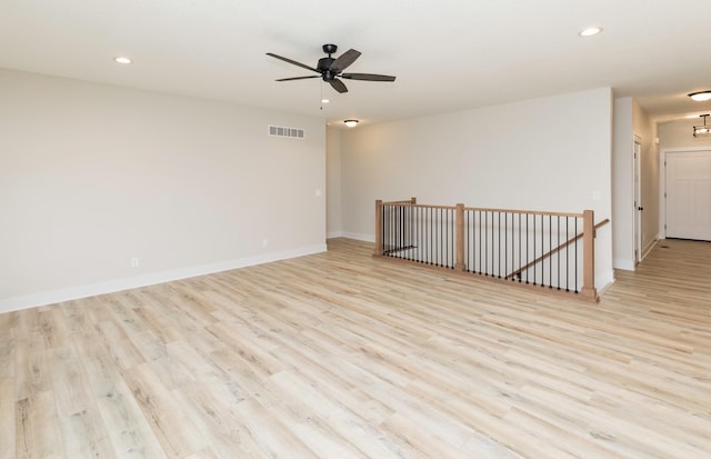 unfurnished room featuring visible vents, baseboards, recessed lighting, ceiling fan, and light wood-style floors