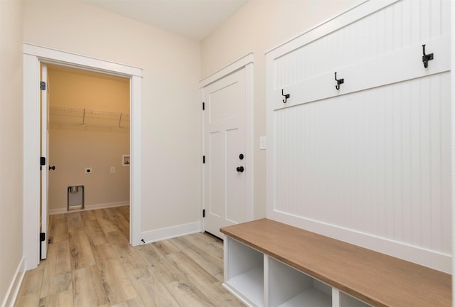 mudroom with baseboards and light wood-style floors