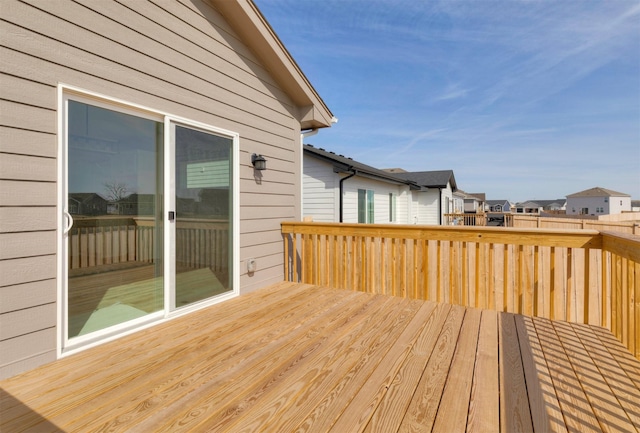 wooden deck with a residential view