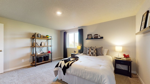 carpeted bedroom with a textured ceiling