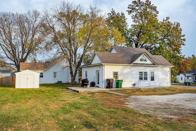 back of house featuring a patio, a storage unit, cooling unit, and a lawn