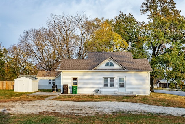 view of front of house featuring a shed