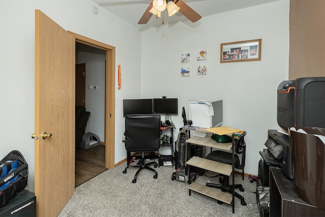 home office featuring ceiling fan and light carpet